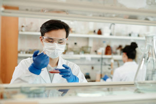 generic lab test image man with pipette and petri dish